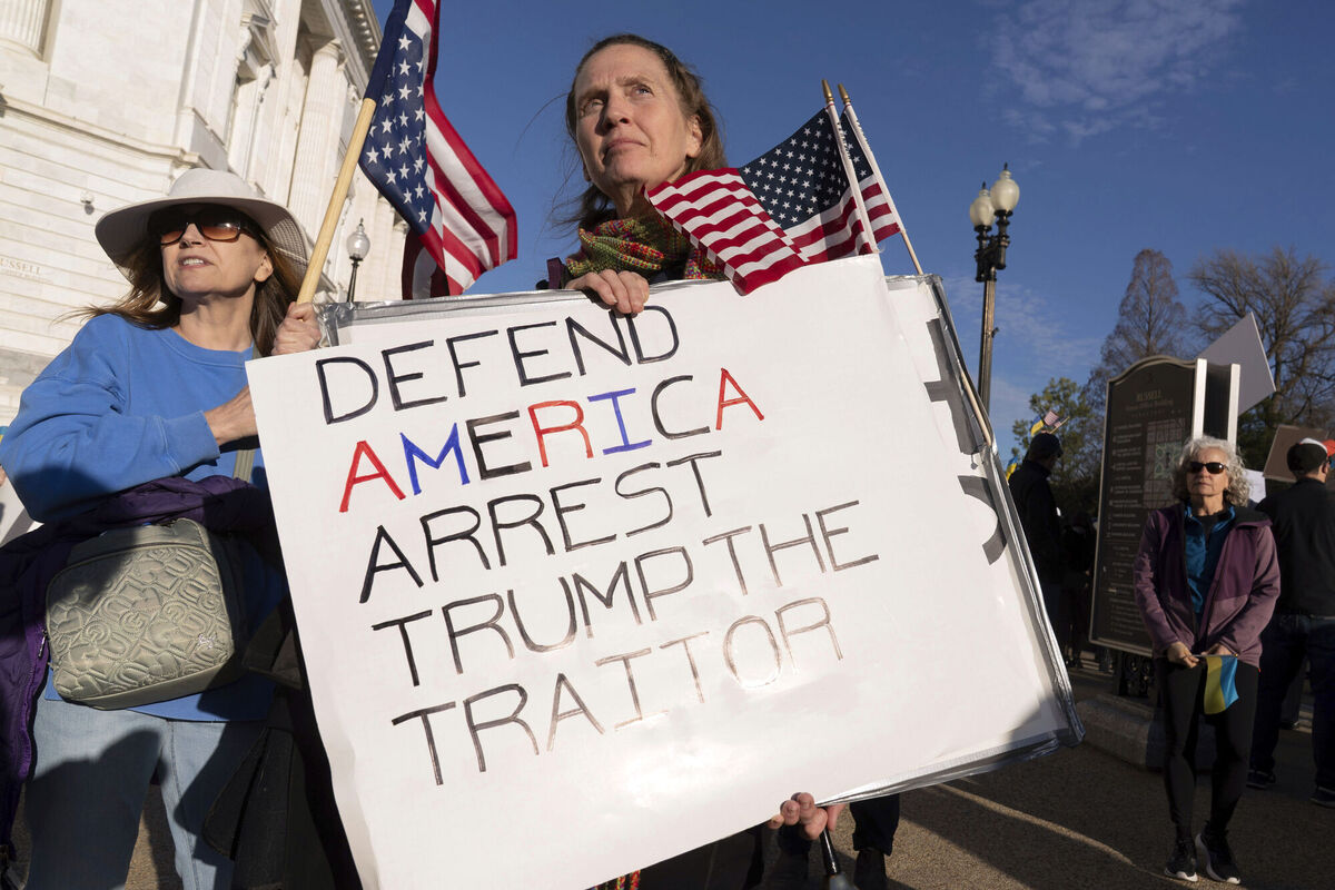 Demonstrators protest near the US Capitol ahead of President Donald Trump address to a joint session of Congress in Washington, Tuesday, March 4, 2025. (AP Photo/Jose Luis Magana)