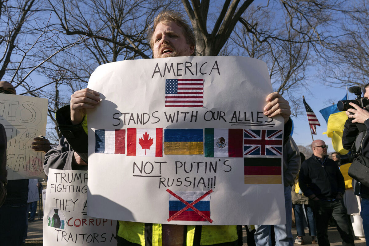 Demonstrators protest near the Capitol ahead of Donald Trump's address. Picture: AP Photo/Jose Luis Magana