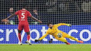 <p>YOU SHALL NOT PASS: Liverpool goalkeeper Alisson Becker (right) makes a save during the UEFA Champions League Round of 16, first leg match at the Parc des Princes in Paris, France. Pic: Adam Davy/PA Wire</p>