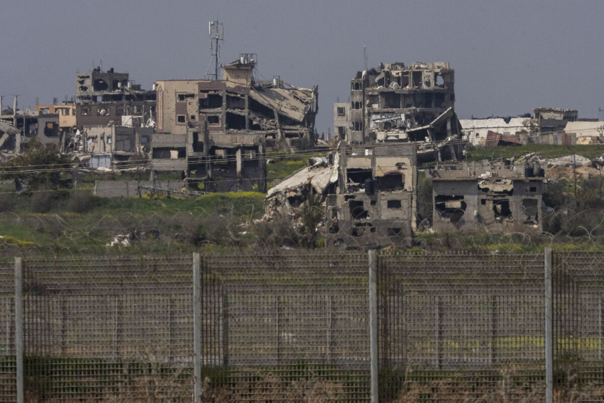 Destroyed buildings by Israeli bombardments in the northern Gaza Strip as seen from southern Israel. File picture: Ariel Schalit/AP Destroyed buildings by Israeli bombardments in the northern Gaza Strip as seen from southern Israel. File picture: Ariel Schalit/AP