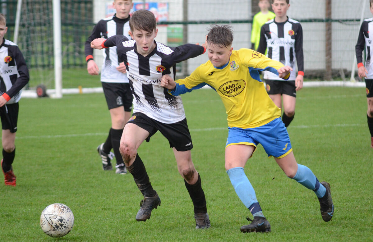 2022: Midleton's Ben Dumigan clashes with Carrigaline Hibs' Jack O'Grady Pic: Howard Crowdy 2022: Midleton's Ben Dumigan clashes with Carrigaline Hibs' Jack O'Grady Pic: Howard Crowdy