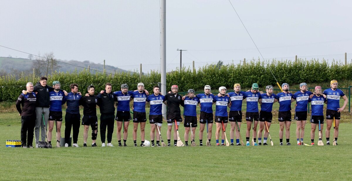  Sarsfields squad during the minutes silence for the late Ray Rayn. Pic: Jim Coughlan.