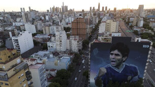 A large mural of the late football star Diego Maradona, by artist Martin Ron, in Buenos Aires (Natacha Pisarenko/AP)