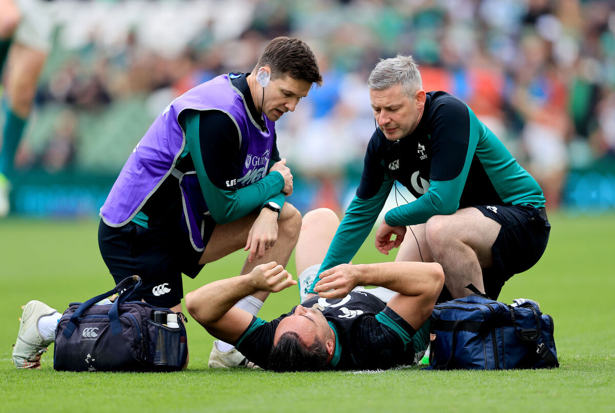 Ireland physiotherapist Keith Fox treats James Lowe for an injury during the warm up at the Aviva. Pic: Dan Sheridan/Inpho