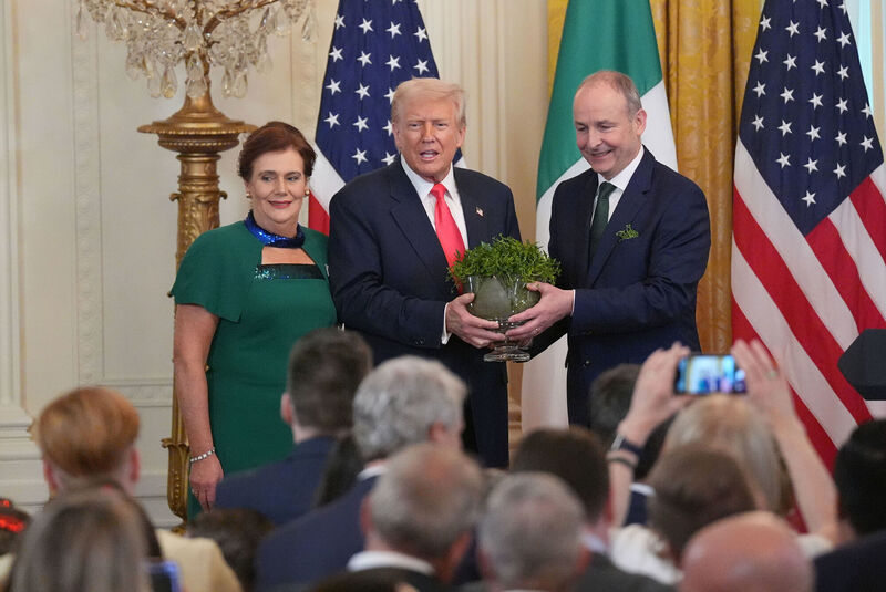 Taoiseach Micheal Martin and US President Donald Trump during the St Patrick's Day Reception and Shamrock Ceremony in the the East Room of the White House, in Washington DC, as part of his week long visit to the US. Picture: Niall Carson/PA Wire Taoiseach Micheal Martin and US President Donald Trump during the St Patrick's Day Reception and Shamrock Ceremony in the the East Room of the White House, in Washington DC, as part of his week long visit to the US. Picture: Niall Carson/PA Wire