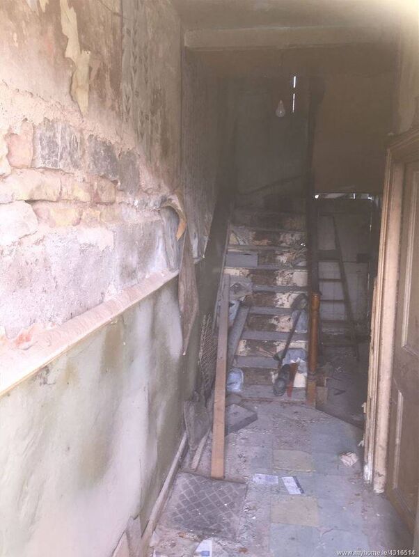 Dank hallway before builders got stuck in