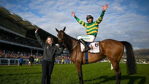<p>Gold Cup winning jockey Mark Walsh celebrates aboard Inothewayurthinkin, with groom Caoimhe O'Brien. Pic: David Fitzgerald/Sportsfile</p>
