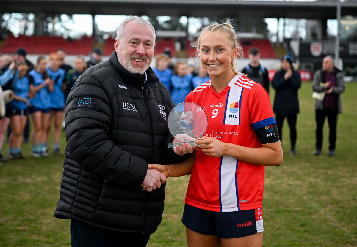 Katie O'Driscoll of MTU Cork is presented with the Player of the Match award by Ladies HEC Chairperson, Daniel Caldwell, after the 2025 Ladies AIG Lynch final match between MTU Cork and UCD at Queen's Sport, Queens University, Belfast. Photo by Ben McShane/Sportsfile