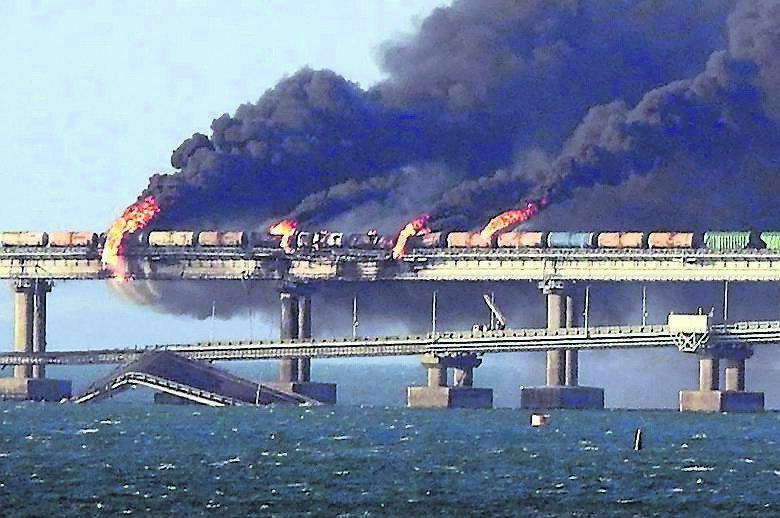 Smoke billows after the 2022 bombing of the Kerch bridge, Russia’s sole land link with Ukraine’s Crimean peninsula, which Russia has been occupying since 2014. Picture: AFP/Getty