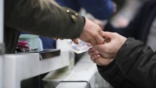 <p>YOU BET: Racegoers at the bookmakers at Cheltenham Racecourse. Pic: Alan Crowhurst/Getty Images</p>
