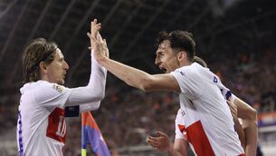 <p>WRAP: Croatia's forward Ante Budimir (R) celebrates with Croatia's midfielder #10 Luka Modric after scoring the opening goal. Pic: DAMIR SENCAR/AFP via Getty Images</p>