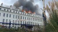 Part of fire-hit seaside hotel collapses