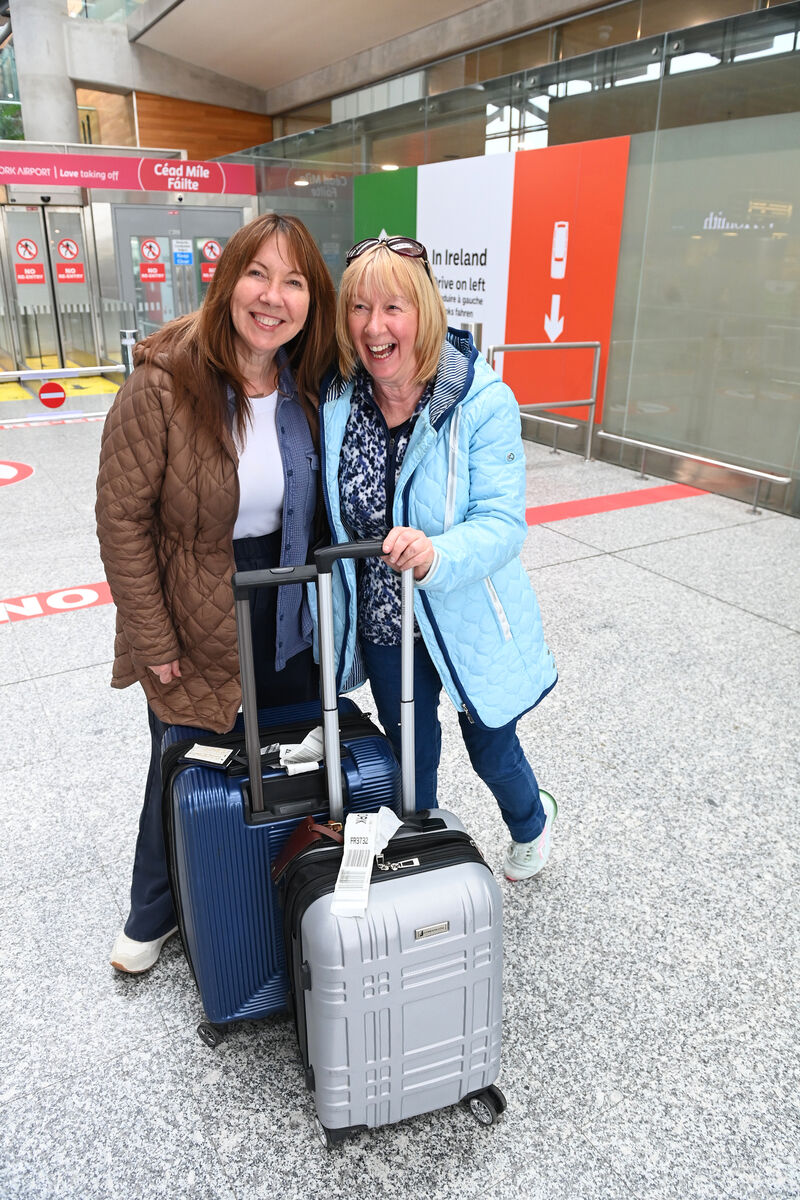 Deirdre Rock, left, with her sister Christine Rock at Cork Airport. Deirdre's plans were disrupted by the Heathrow shutdown when her flight from New York was diverted to Glasgow. Of the Heathrow disruption, Deirdre says: 'I was sure it was a terrorist attack because that’s where my brain goes. It could always have been worse.' Picture: Larry Cummins