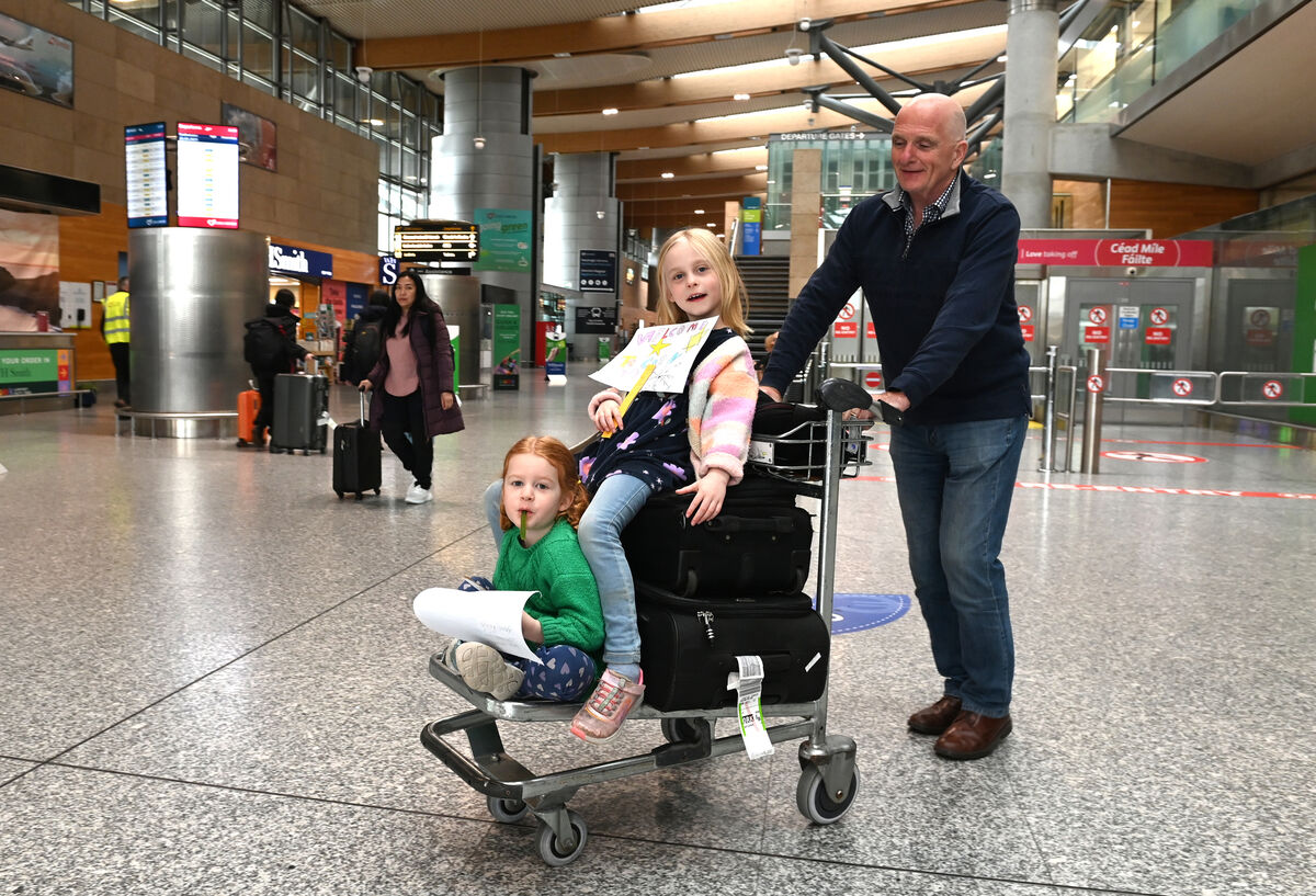  Sisters Roisín and Eve Crowley from Clonakilty, greeted their granddad Peter Dolan, originally from Co Roscommon and now living in Melbourne, Australia. Peter's flight to Londow Heathrow was diverted to Paris. He eventually got a flight from Paris to Cork Airport. Picture: Larry Cummins