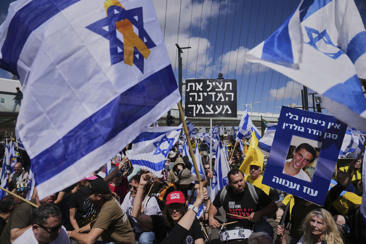 Israelis march in a protest against Prime Minister Benjamin Netanyahu and his plans to dismiss the head of the Shin Bet internal security service earlier this week. Picture: AP Photo/Ohad Zwigenberg