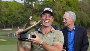 <p>Viktor Hovland, of Norway, reacts as he hold the trophy after winning the Valspar Championship golf tournament Sunday at Innisbrook in Palm Harbor, Florida. Picture: Chris O'Meara/AP</p>
