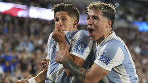 <p>Argentina's Giuliano Simeone, left, celebrates with teammate Enzo Fernandez scoring his side's fourth goal against Brazil. Pic: AP Photo/Natacha Pisarenko</p>