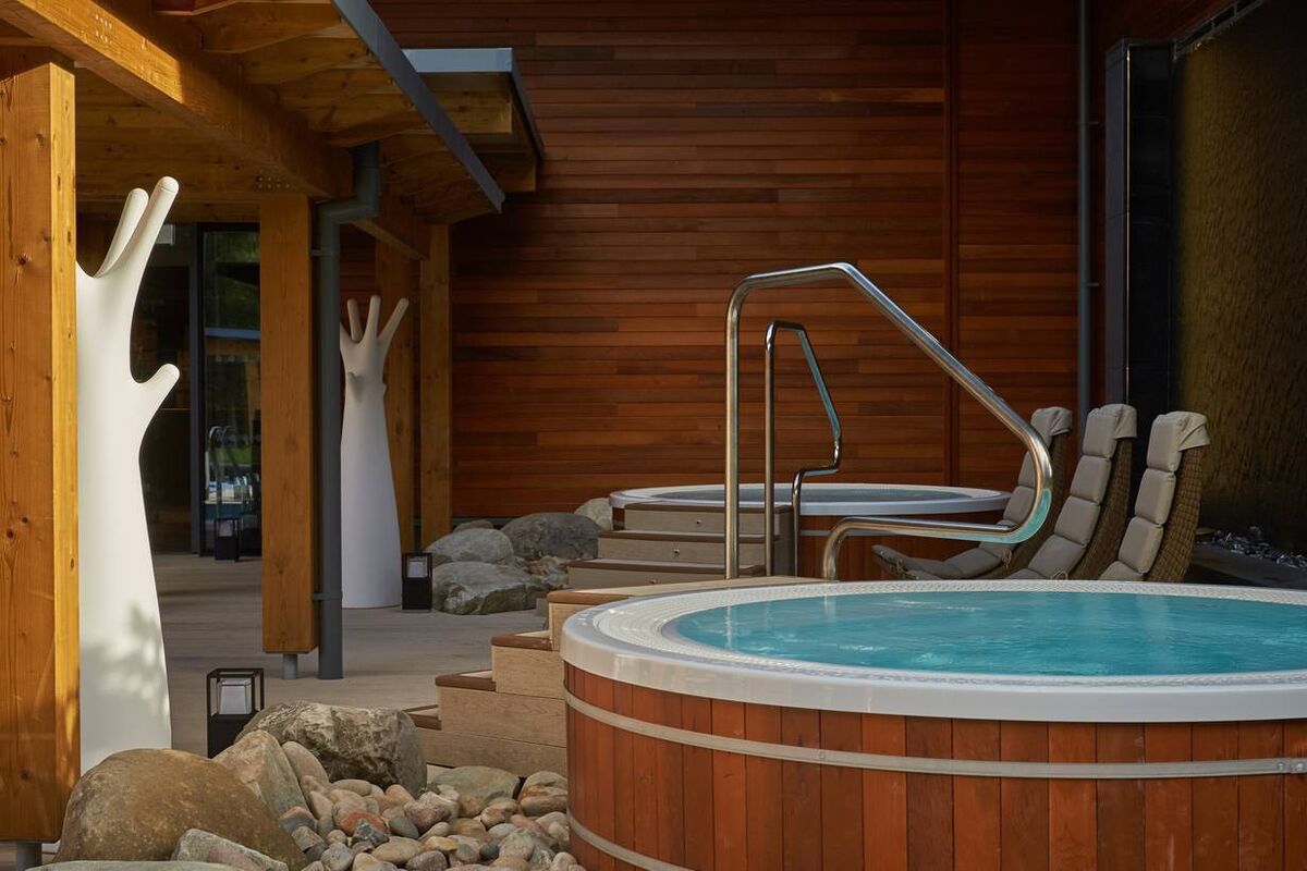 Outdoor hot tubs and comfortable lounge seating at Aqua Sana Forest Spa, Centre Parcs, Co Longford.