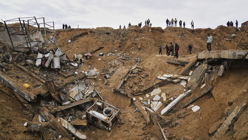Palestinians inspect the rubble of a structure hit by an Israeli bombardment in Deir al-Balah, Gaza Strip last Saturday. File photo: AP/Abdel Kareem Hana