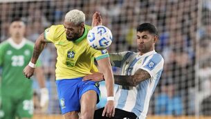 <p>BRUISING NIGHT: Brazil's Joelinton, left, and Argentina's Cristian Romero vie for the ball during a World Cup 2026 qualifying soccer match at Monumental Stadium in Buenos Aires, Argentina, Tuesday, March 25, 2025. (AP Photo/Gustavo Garello)</p>