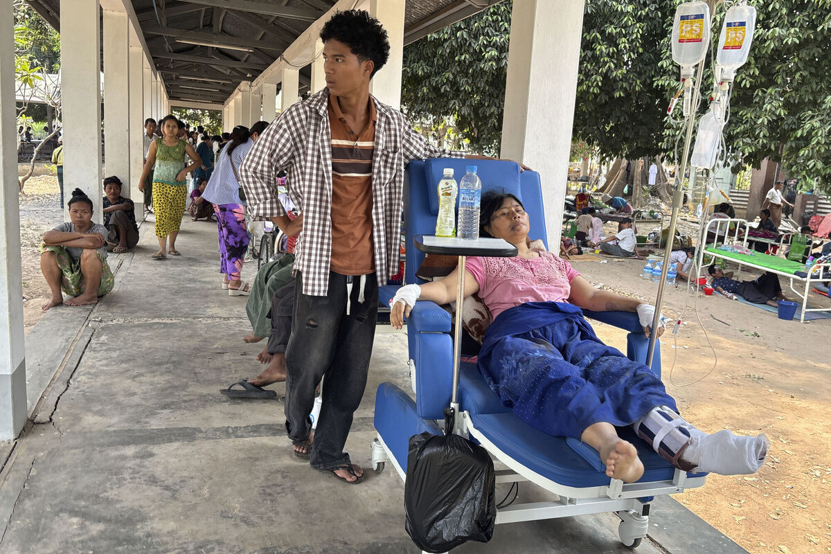 A woman injured by Friday's earthquake waits to receive treatment at the 1000-bed hospital in Naypyitaw, Myanmar, Saturday, March 29, 2025. (AP Photo/Aung Shine Oo)