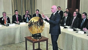 <p>Gianni Infantino unlocks the new Fifa Club World Cup trophy during last month’s White House crypto summit. Pic: AP</p>