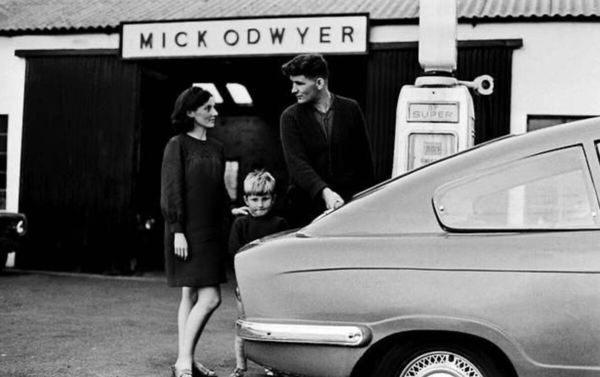 Mick O'Dwyer at his garage in Waterville with his late wife Mary Carmel and one of his children. Mick O'Dwyer at his garage in Waterville with his late wife Mary Carmel and one of his children.