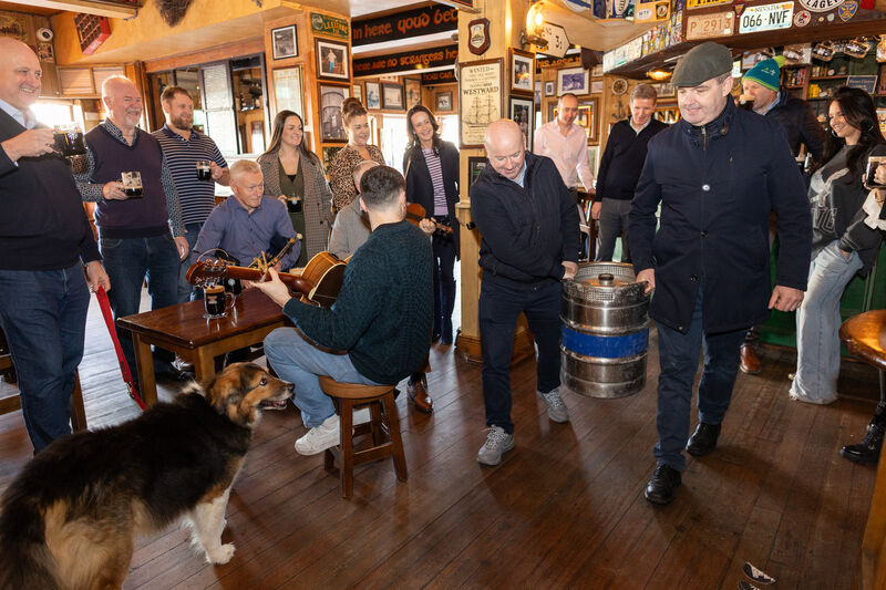 Alan Campbell of the The Bankers (left) and Ronan Lynch of The Swan (right) carry a keg of the new Clockwork Velvet Stout into the Ferryman.  Picture: Naoise Culhane 