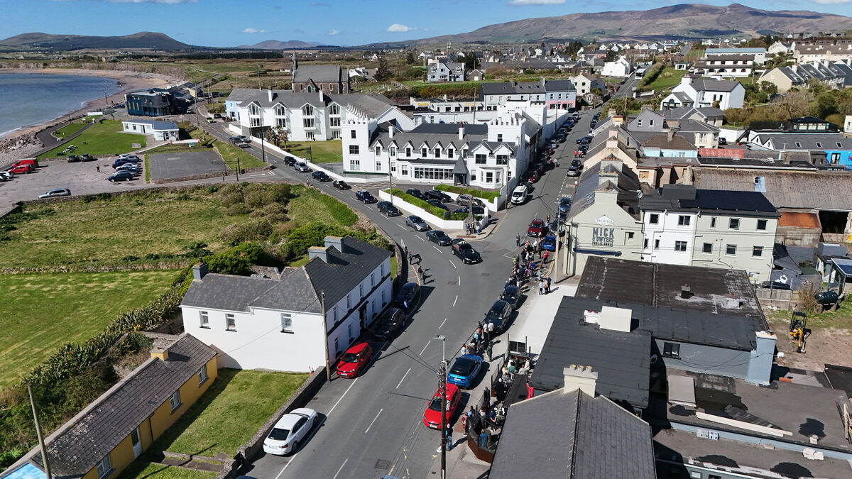  The funeral cortège of Mick O'Dwyer making its way through Waterville, Co Kerry, passing his bar on the right. Picture: Dan Linehan