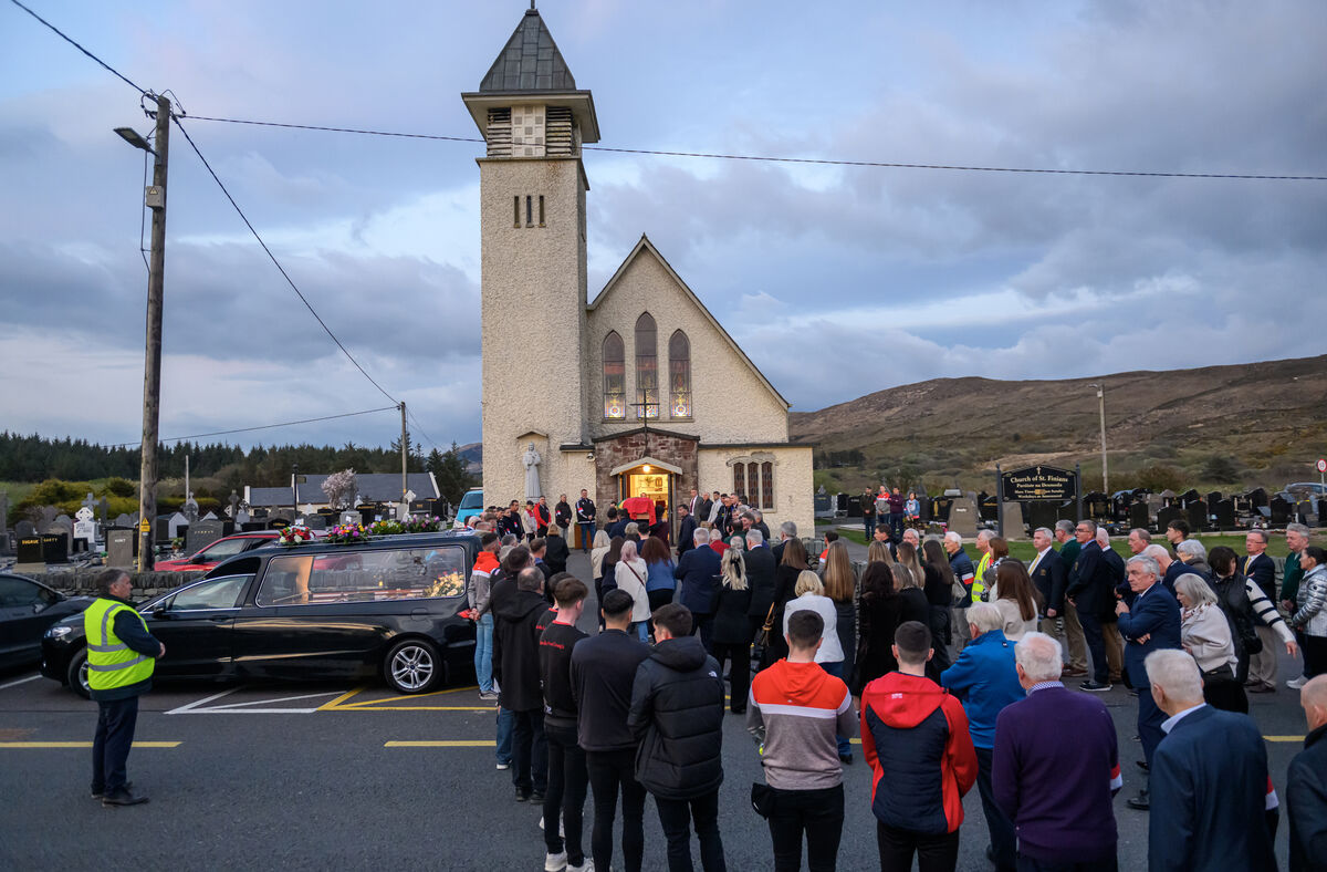  The coffin of Mick O'Dwyer is shouldered by members of Waterville GAA and followed his wife Geraldine and family members into St Finian’s Church, Waterville, Co Kerry. Picture: Dan Linehan