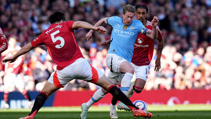 <p>Manchester City's Kevin De Bruyne gets past Manchester United's Harry Maguire. Pic: Martin Rickett/PA Wire</p>