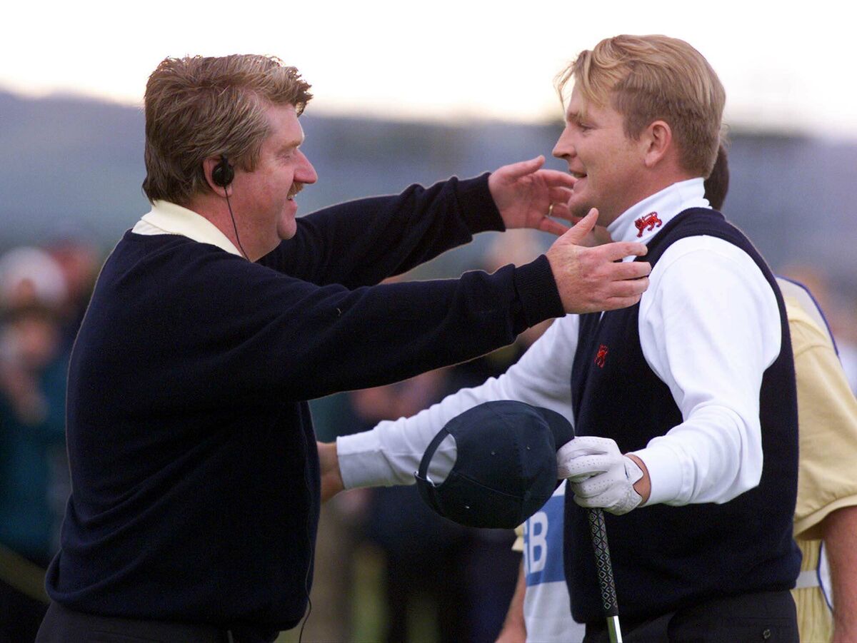 Great Britain and Ireland Captain Peter McEvoy reaches out to hug Irish golfer Paddy Gribben who made the winning putt to beat America 15-9 in the Walker Cup at Nairn Golf Club in Scotland on September 12 1999. File Pic: Ian Stewart/AP