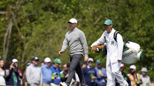 <p>CHASING THE GREEN JACKET: Rory McIlroy, of Northern Ireland, walks with caddie Harry Diamond on the fifth hole during a practice round at the Masters. Pic: Ashley Landis/AP</p>