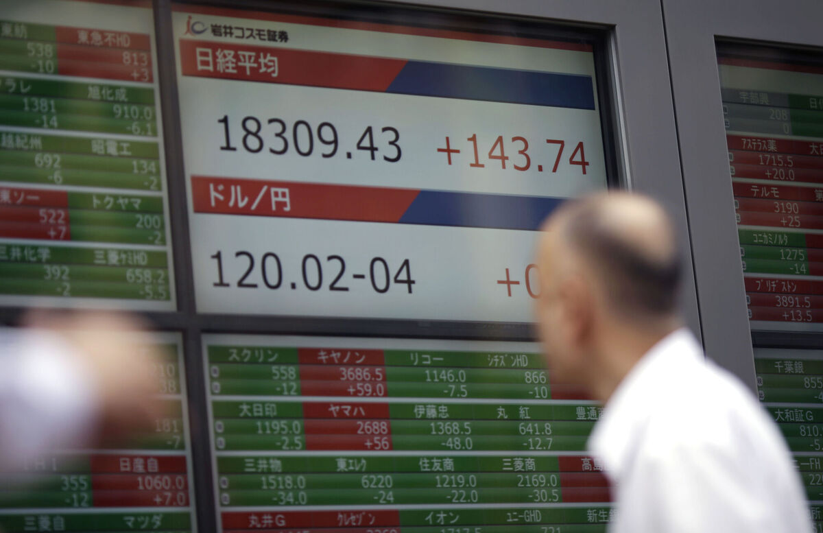 Chinese stocks advanced on expectations for more stimulus after Trump increased levies on the country to 125%. (AP Photo/Eugene Hoshiko)