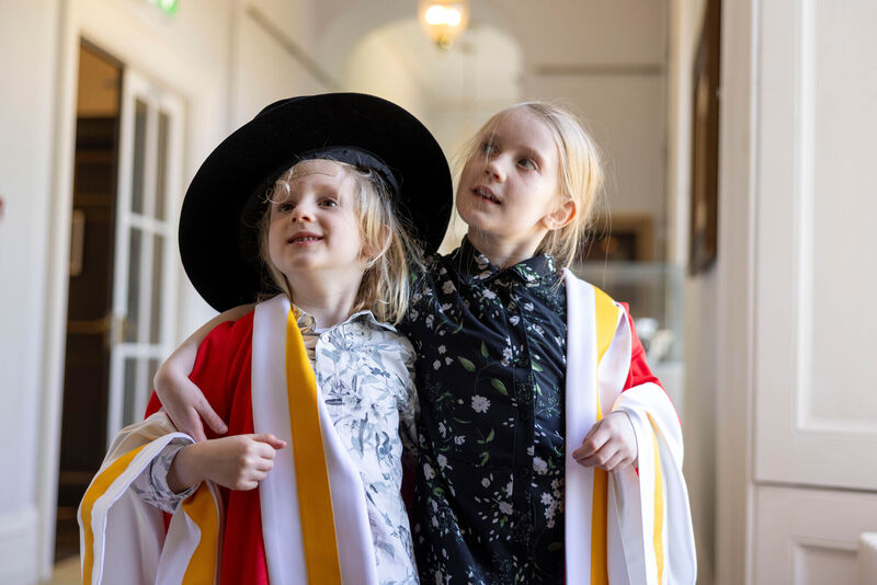 Paul Lynch's children Elliot (left) and Amelie waiting for their dad to receive his Honorary Doctorate at University of Limerick. Picture: Sean Curtin