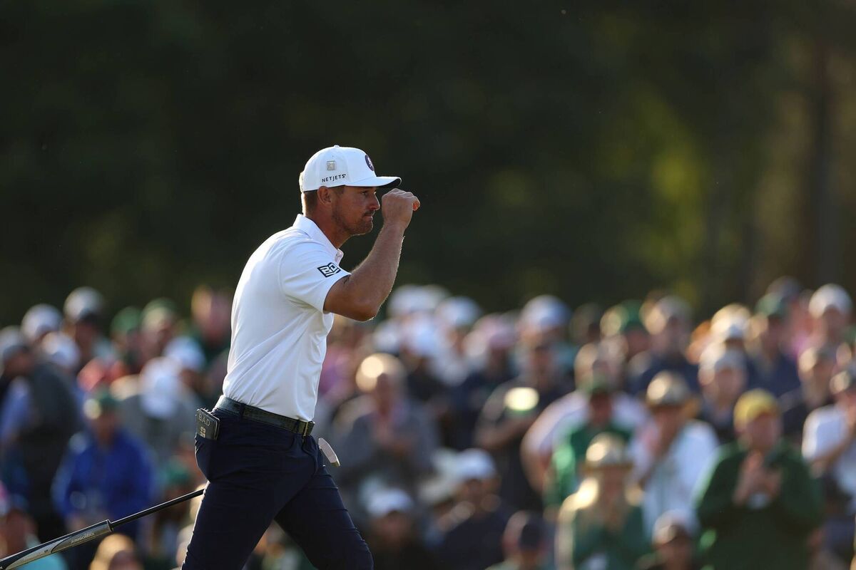 Bryson DeChambeau of the United States acknowledges the crowd as he walks onto the 18th green during the third round of the 2025 Masters Tournament at Augusta National Golf Club on April 12, 2025 in Augusta, Georgia. (Photo by Richard Heathcote/Getty Images)