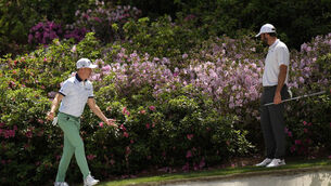 <p>Scottie Scheffler helps Justin Thomas look for his ball on the 13th hole during the first round at the Masters. Pic: David J. Phillip/AP</p>