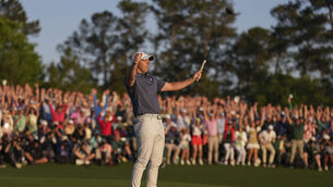 <p>Rory McIlroy was overcome with emotion after winning a play-off against Justin Rose to clinch the Masters (Matt Slocum/AP)</p>