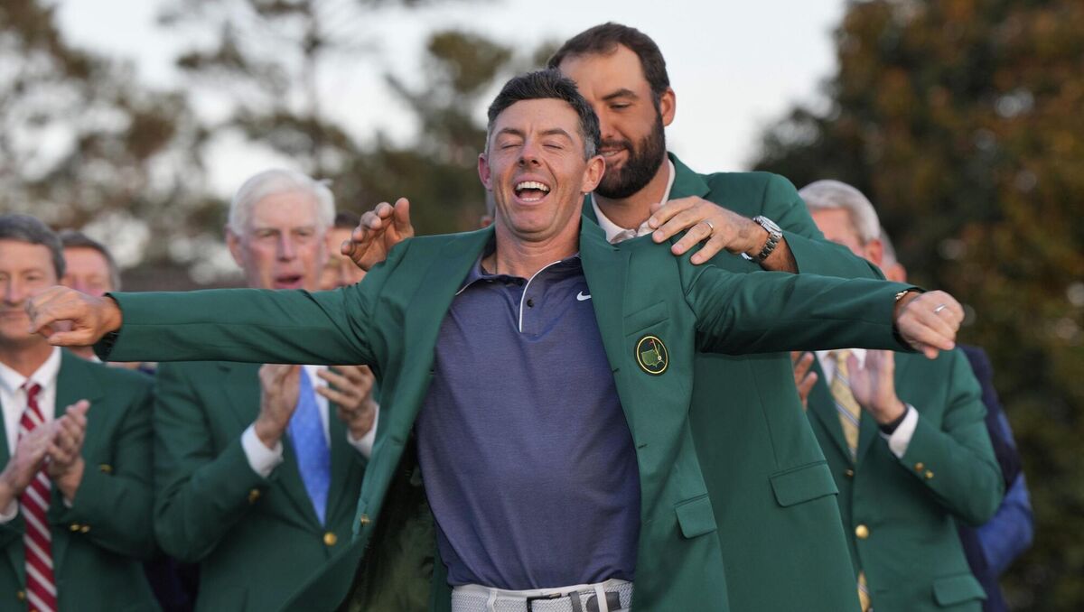 Scottie Scheffler puts the green jacket on Masters winner Rory McIlroy. Picture: (AP Photo/David J. Phillip