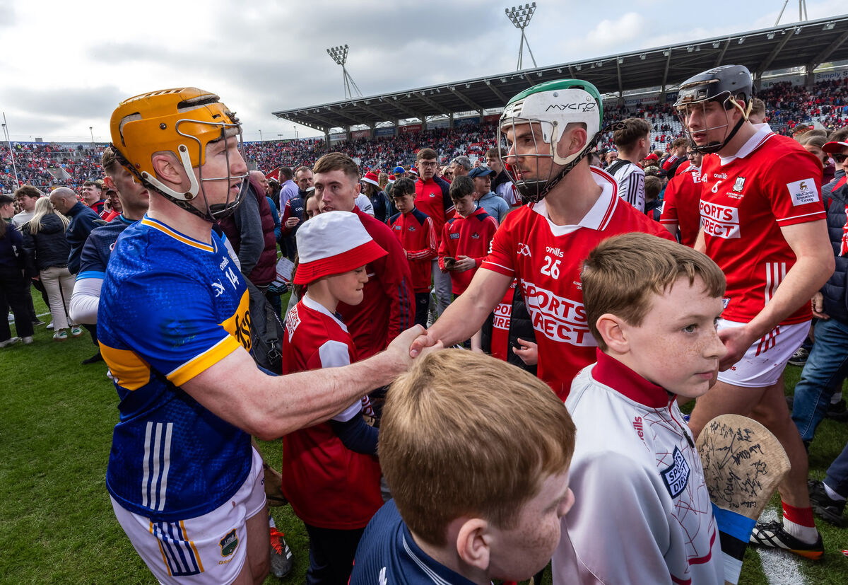 Tipperary’s Jake Morris and Shane Kingston of Cork after the league final. Pic: James Crombie/Inpho
