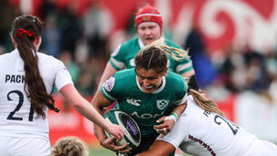 <p>Ireland's Erin King is tackled by Maddie Feaunati of England. Pic: Ben Brady/Inpho</p>