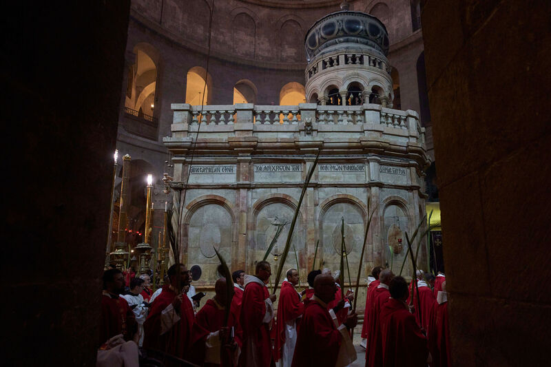 Roman Catholic clergymen carry palm fronds during the Palm Sunday procession at Church of the Holy Sepulchre, traditionally believed by many to be the site of the crucifixion and burial of Jesus Christ, in Jerusalem's Old City. Picture: AP Photo/Ohad Zwigenberg Roman Catholic clergymen carry palm fronds during the Palm Sunday procession at Church of the Holy Sepulchre, traditionally believed by many to be the site of the crucifixion and burial of Jesus Christ, in Jerusalem's Old City. Picture: AP Photo/Ohad Zwigenberg