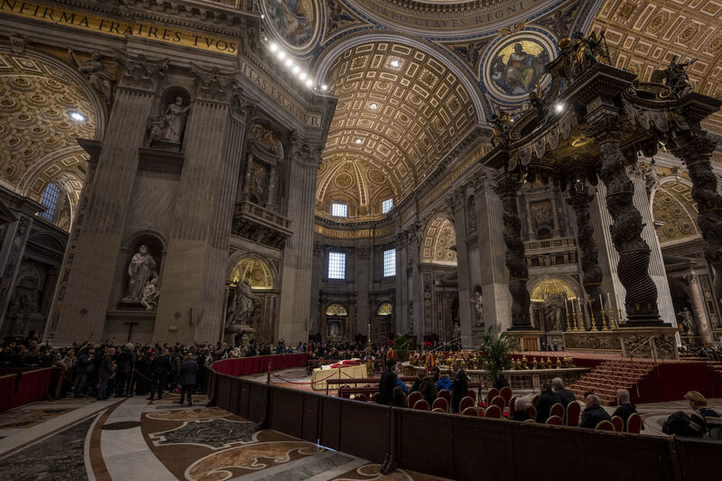 The body of Pope Emeritus Benedict XVI lies in state inside St. Peter's Basilica at The Vatican where thousands went to pay their homage Monday, Jan. 2, 2023. Picture: AP Photo/Ben Curtis