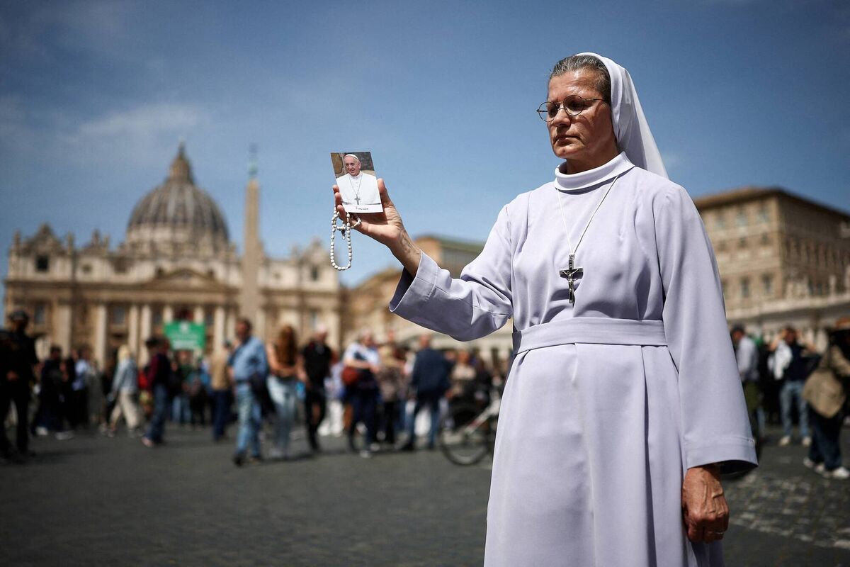 A nun holds an image of Pope Francis near St Peter's square, after the death of Pope Francis was announced by the Vatican on Monday morning Pictures. Reuters/Guglielmo Mangiapane 