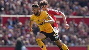 <p>Manchester United’s Tyler Fredricson and Wolverhampton Wanderers' Matheus Cunha battle for the ball. Pic: Martin Rickett/PA Wire.</p>