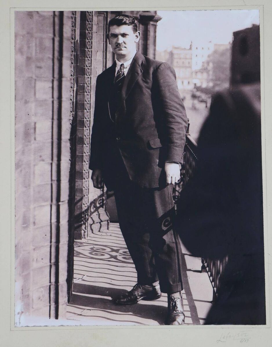 A full-length portrait photograph of Michael Collins in London by Lafayette at Fonsie Mealy. A full-length portrait photograph of Michael Collins in London by Lafayette at Fonsie Mealy.