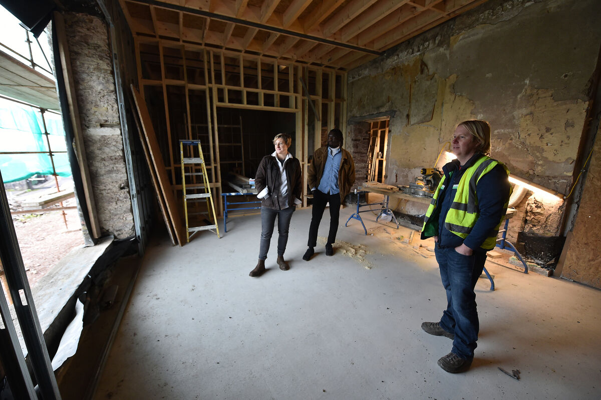 Leo Linehan of Linehan Construction and architects Alannah-Rose O'Grady-Kennedy and Bilal Mu'azzam in the dining room in 2022 during work on Carrig House. Picture: Dan Linehan