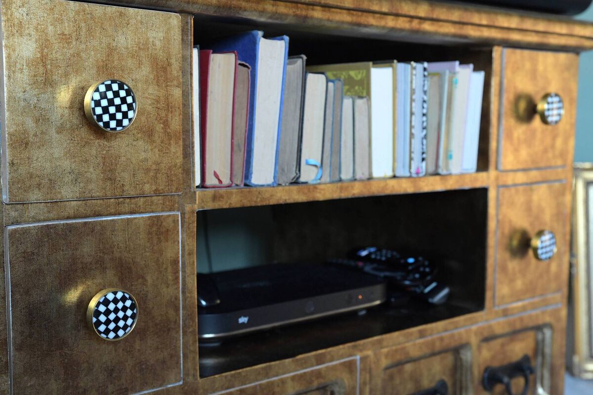 A cabinet/TV stand in the sitting room.