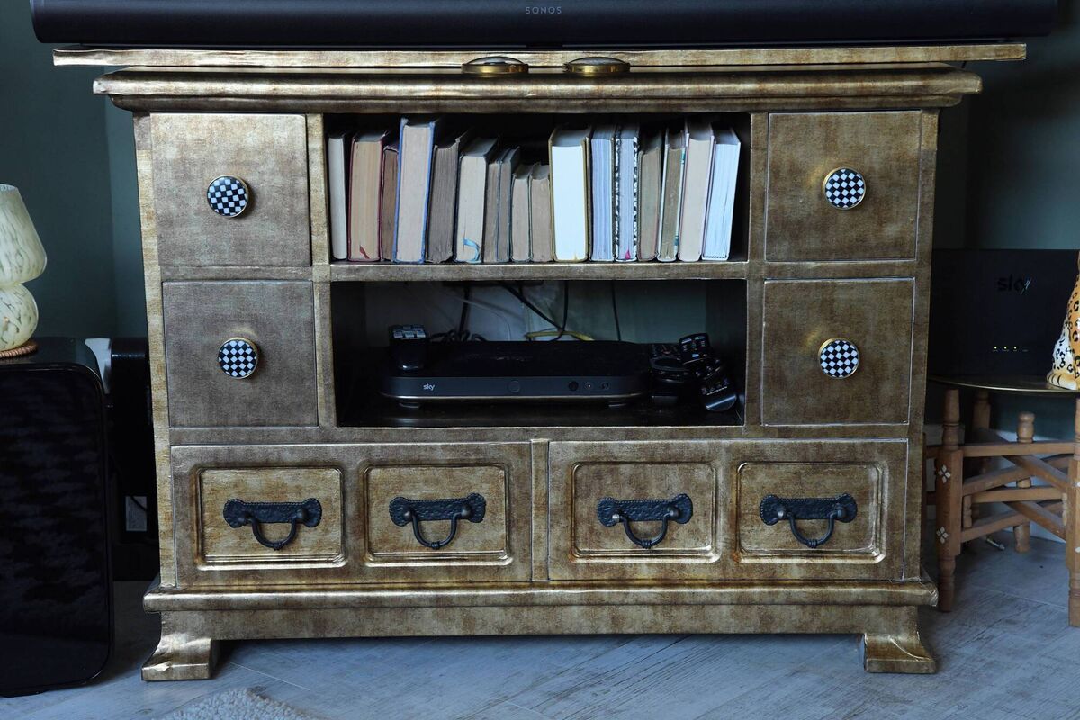 A cabinet/TV stand Katrina's sitting room.