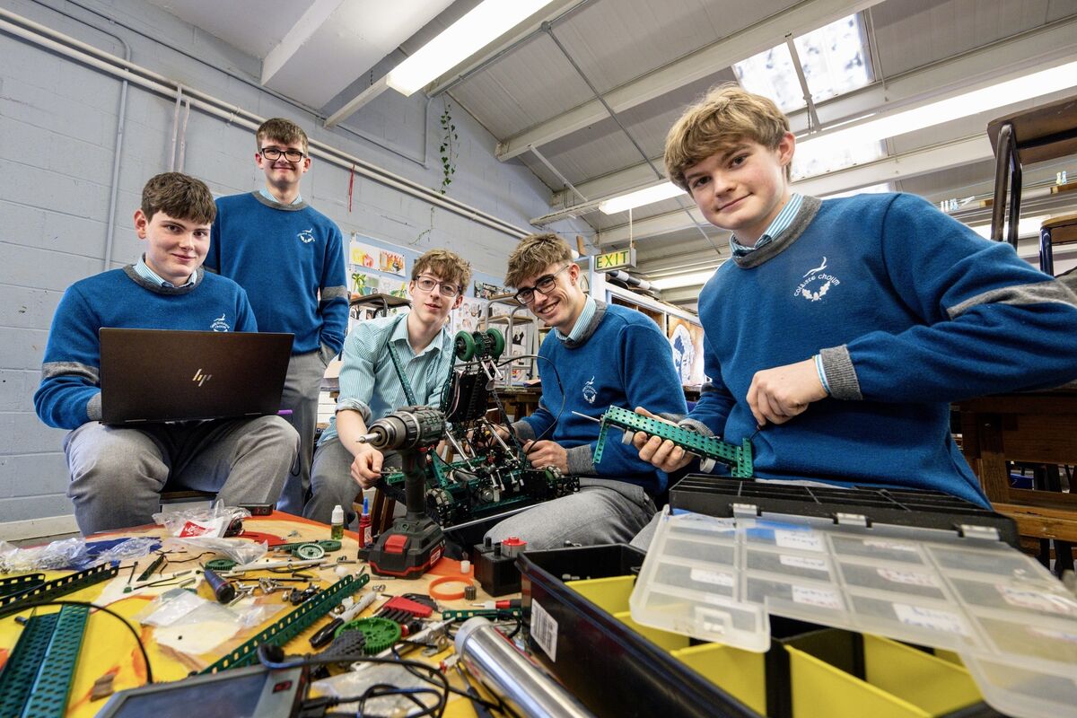 The Gaelcholáiste Choilm robotics team, from left, Cillian O’Toole, Fionn Beale Walsh, Ferdia Cussen Gannon, Sean Springorum and Colm Doyle put their robot through its paces during a practice session as they prepare for the VEX World Finals in Texas. Picture: Chani Anderson